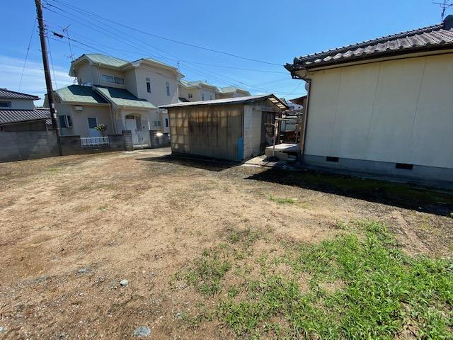 現地土地／敷地入り口方向写真