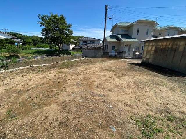 現地土地／敷地入り口方向写真